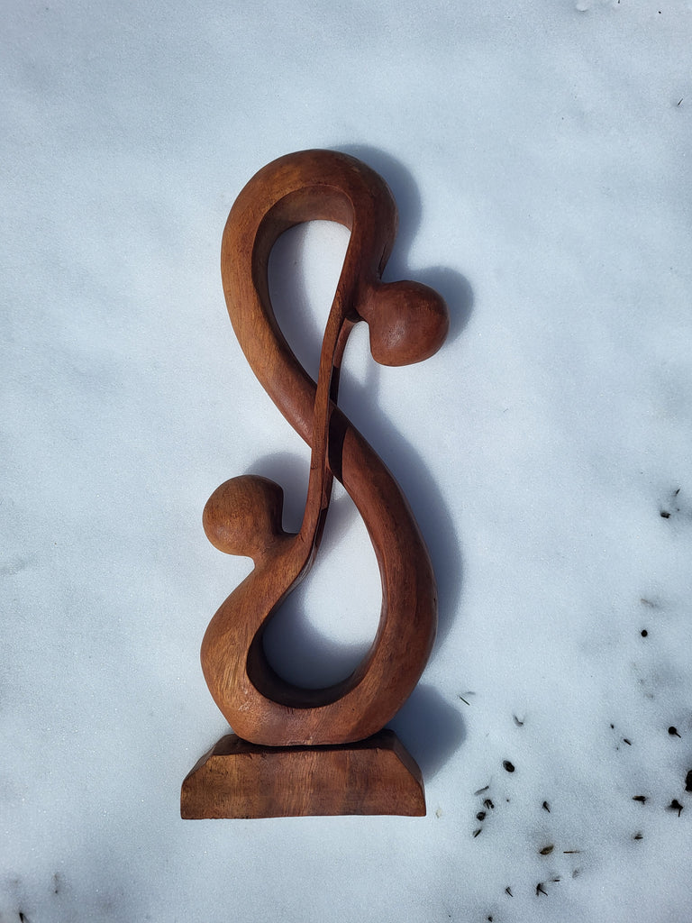 Wooden human infinity sculpture – The Pearl of Door County