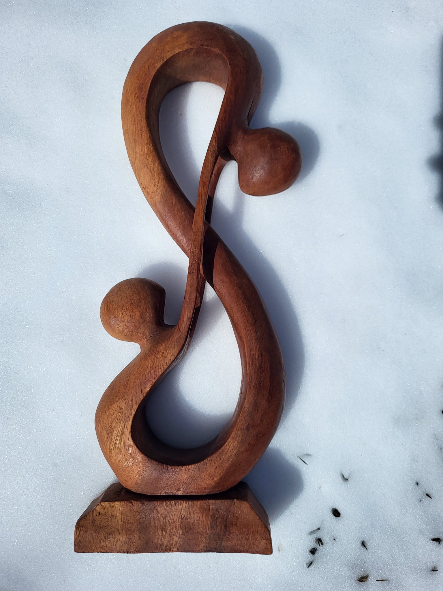Wooden human infinity sculpture